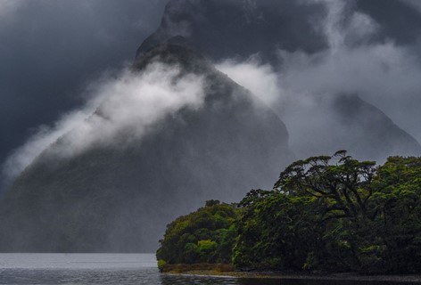 Moody Clouds strung between Milford Sound peaks and the sound.