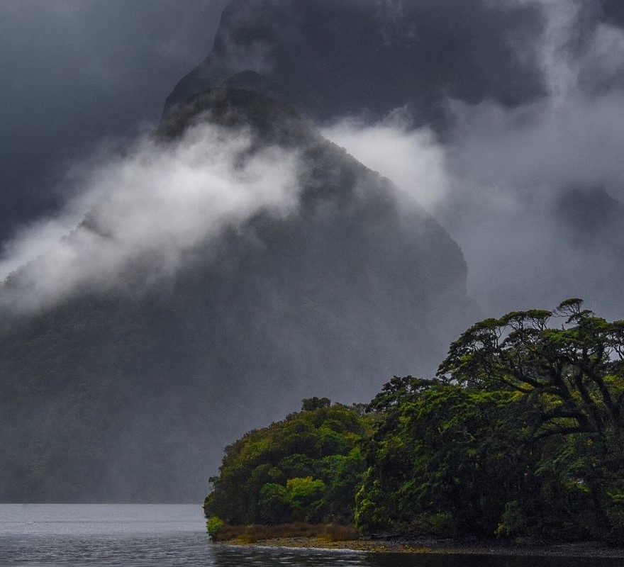 Moody Clouds strung between Milford Sound peaks and the sound.