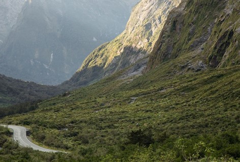 The Milford Road emerging between the Fiordland mountains on the way to Milford Sound Lodge.