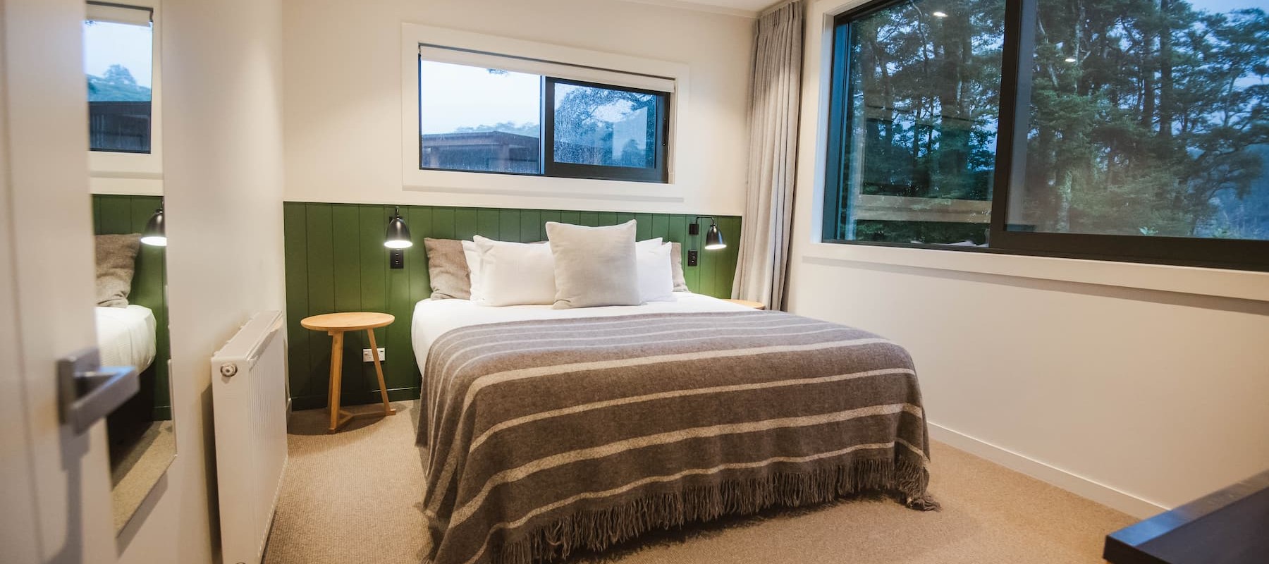 A 2-Bedroom Garden Chalet bedroom at Milford Sound Lodge, Milford Sound accommodation.